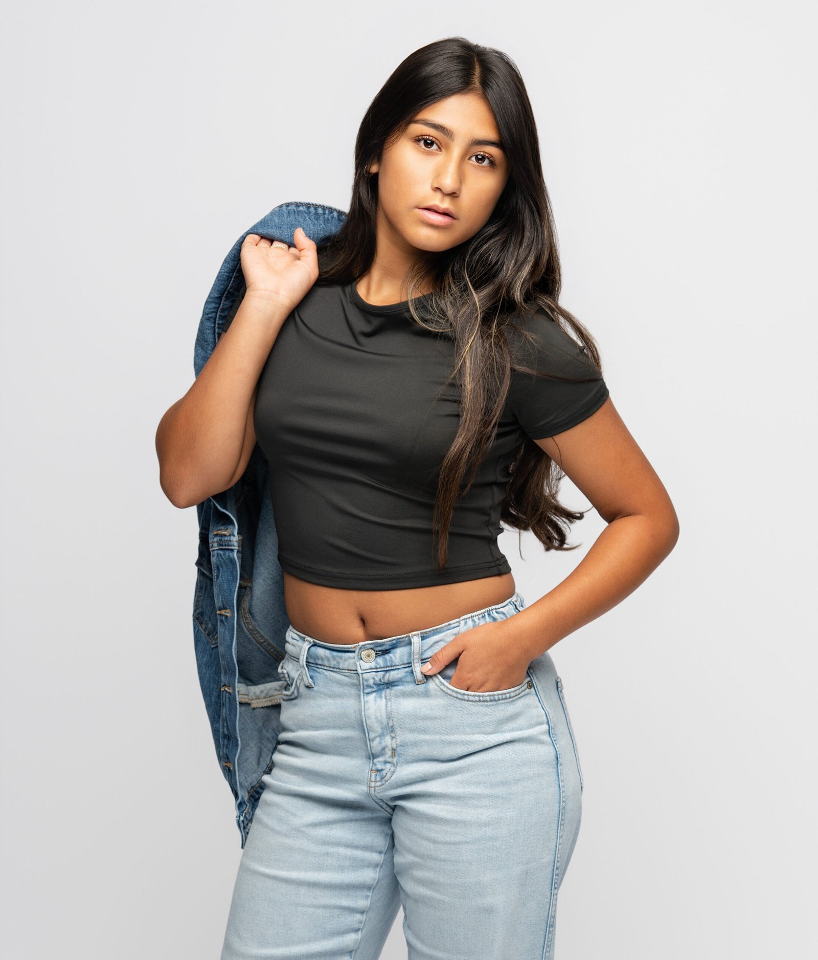 Teen model posing in a professional studio portrait